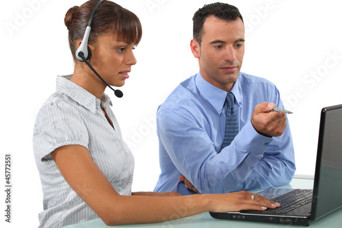Photo: businessman and businesswoman working together businessman and businesswoman working together