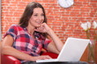 Relaxed woman using her laptop
