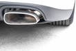 exhaust pipe of a white sports car