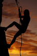 Photo: Woman silhouette rock climb Woman silhouette rock climb