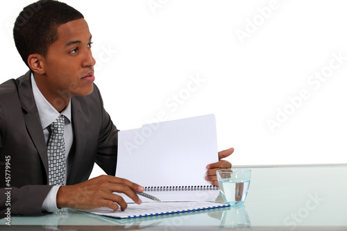 Photo: Worker checking report Worker checking report