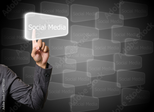 Illustration: businessman hand pushing Social Media button on a touch screen businessman hand pushing Social Media button on a touch screen