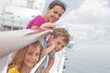 Photo: Mother with children stand on deck of passenger ship Mother with children stand on deck of passenger ship