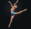 Young woman in gymnast suit posing