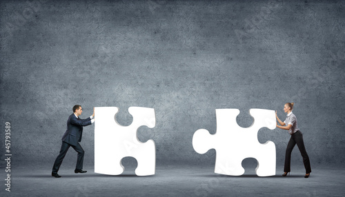 Photo: Piece of puzzle and business persons Piece of puzzle and business persons