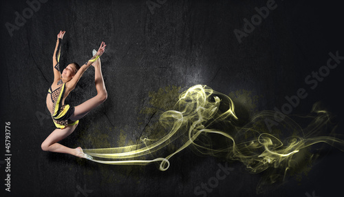Photo: Young woman in gymnast suit posing Young woman in gymnast suit posing