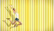 young woman dancing and jumping...