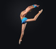 Young woman in gymnast suit posing