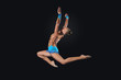 Young woman in gymnast suit posing