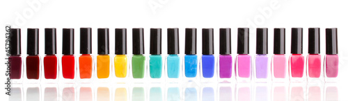 Photo: Group of bright nail polishes isolated on white Group of bright nail polishes isolated on white