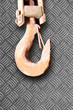 Rusty crane hook on diamond plate 