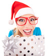 Funny santa girl giving a present