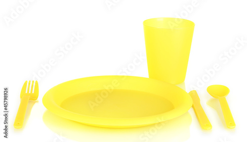 Photo: bright plastic disposable tableware isolated on white bright plastic disposable tableware isolated on white
