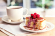 sweet cake with cup of tea on wooden table