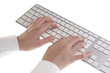 Woman typing on keyboard on white background