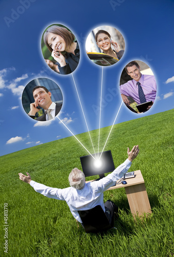 Photo: Businessman Computer Network In Green Field Businessman Computer Network In Green Field