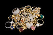 Foto: Gold jewelry on a black background Gold jewelry on a black background
