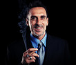 Successful businessman smoking a cigar