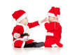 two funny small kids in Santa Claus clothes isolated on white ba
