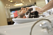 A male hairdresser shampooing a male clients hair