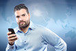 Photo: Handsome young man with smart phone Handsome young man with smart phone