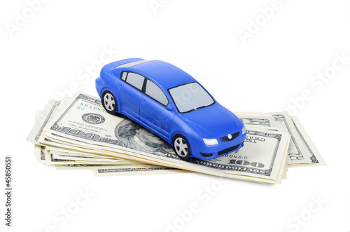 Photo: The toy car for dollar banknotes as a background The toy car for dollar banknotes as a background