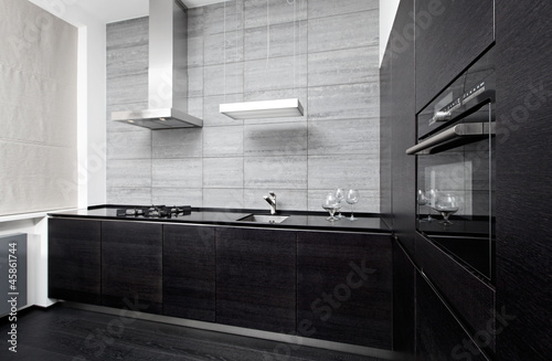 Photo: Part of modern minimalism style kitchen interior in monochrome Part of modern minimalism style kitchen interior in monochrome