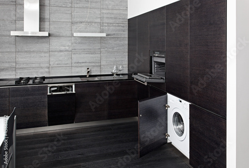 Photo: Part of black hardwood kitchen with build-in domestic technique Part of black hardwood kitchen with build-in domestic technique