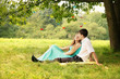 under a tree hugging
