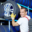 Car mechanic stores winter tires for tire changing
