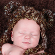 Photo: Cute little Newborn Baby boy posing for camera Cute little Newborn Baby boy posing for camera