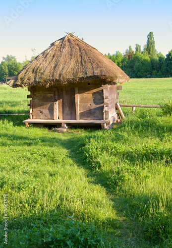 Photo: Old rural house with a straw roof Old rural house with a straw roof