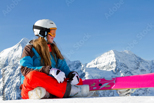 Photo: Winter sport - portrait of young snowboarder girl Winter sport - portrait of young snowboarder girl