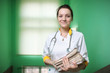 Foto: Portrait of female doctor with medical records. Portrait of female doctor with medical records.