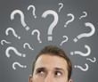 Man thinking concept with question marks close up