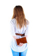 back view of standing redhaired woman with  notebook looking
