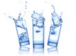Water splash in glasses on white