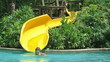 Child riding on water slide.