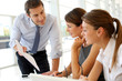 Manager presenting business plan to employees