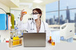 Photo: Doctor analyzing yellow liquid at the hospital Doctor analyzing yellow liquid at the hospital