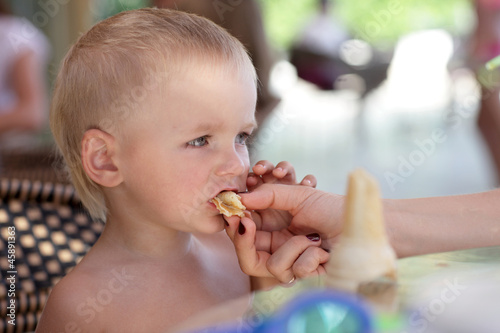 Photo: Mother feeding child Mother feeding child
