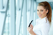 Businesswoman standing inside a modern house