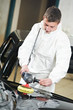 mechanic repairing and polishing car