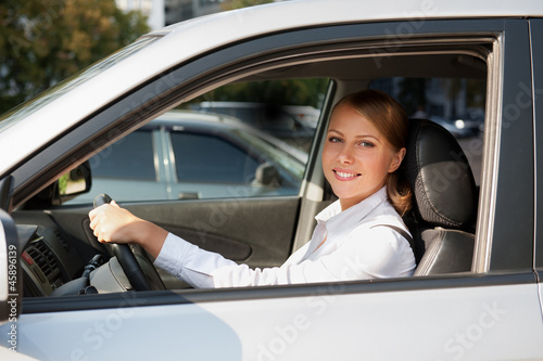 Photo: female at the wheel of her car female at the wheel of her car
