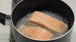 Two wild sockeye salmon fillets poaching