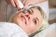 Photo: woman having a stimulating facial treatment from a therapist woman having a stimulating facial treatment from a therapist