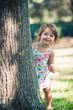 One year little girl playing in the park portrait.