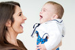mother and baby laughing together