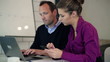 Portrait of happy businesscouple with laptop and smartphone in t