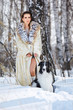 woman with wolfhound outdoors